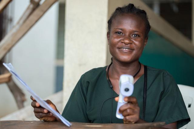 Sarah T. Kollie checks all new arrivals for fever at the emergency entrance of Phebe Hospital, in an effort to prevent the spread of tropical diseases such as Ebola.